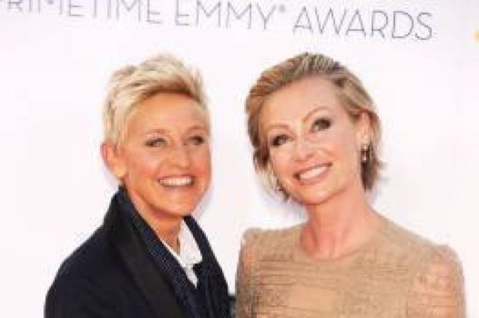 Actress Ellen DeGeneres and Portia de Rossi arrive for the 64th annual Prime Time Emmy Awards at the Nokia Theatre at LA Live in Los Angeles, California September 23, 2012.  AFP PHOTO / ROBYN BECK