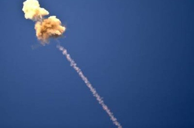 TOPSHOTS  The trail of an Israeli missile launched from the Iron Dome defence missile system is seen along the Gaza border in response to a rocket launched from the nearby Palestinian Gaza Strip on November 15, 2012. Israel will take 
