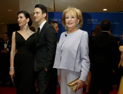 (L-R) Actress Julianna Margulies, her husband Keith Lieberthal and journalist Barbara Walters arrive on the red carpet at the annual White House Correspondents' Association Dinner in Washington, May 3, 2014. REUTERS/Jonathan Ernst (UNITED STATES  - Tags: POLITICS MEDIA ENTERTAINMENT SOCIETY)