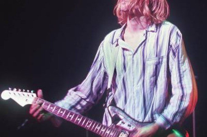 (FILES) This photo taken 19 February 1992 shows Kurt Cobain, lead singer for the US grunge rockers Nirvana, performing at the Nakano Sun Plaza in Tokyo during their 1992 Asian-Pacific tour.  Nirvana frontman Kurt Cobain, who defined grunge and the rise of alternative rock, would have turned 50 on February 20, 2017. He remains an enduring cultural presence even for many young people -- but what would he be doing if he were alive? / AFP / Richard A. Brooks