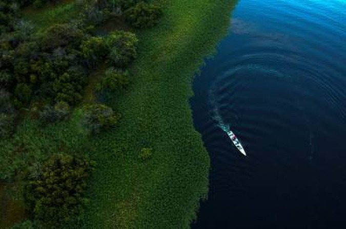 (FILES) In this file photo taken on June 28, 2018 Drone view of Mamiraua Institute and WWF-Brazil researchers working in the area of Maciel Lake at Mamiraua Sustainable Development Reserve in Amazonas state, Brazil. Brazilian far-right presidential candidate Jair Bolsonaro¿s declarations on the environment are a source of deep concern among activists who fear that the Amazonia, the (FILES) In this file photo taken on June 28, 2018 Drone view of Mamiraua Institute and WWF-Brazil researchers working in the area of Maciel Lake at Mamiraua Sustainable Development Reserve in Amazonas state, Brazil. Brazilian far-right presidential candidate Jair Bolsonaro¿s declarations on the environment are a source of deep concern among activists who fear that the Amazonia, the