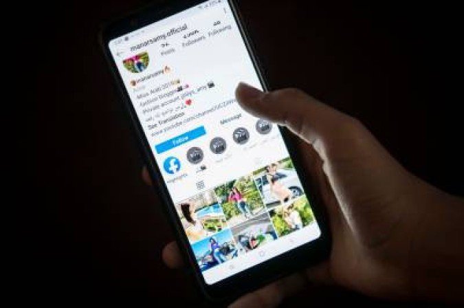 A woman browses the Instagram account of social media influencer Manar Samy, who was sentenced to three years over online videos that were deemed as A woman browses the Instagram account of social media influencer Manar Samy, who was sentenced to three years over online videos that were deemed as