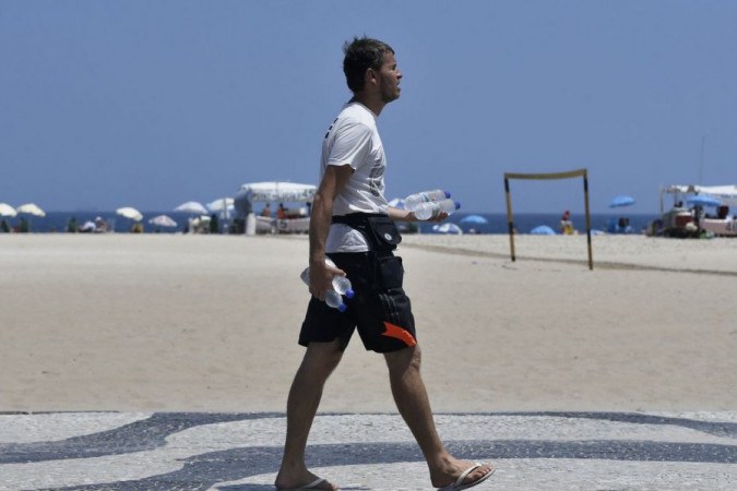 On a hot day in Rio, they cool off on Copacabana beach.