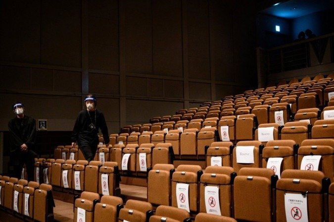 Tókio já recebe eventos públicos, como a semana de moda realizada para apresentar a coleção primavera-verão 2021 -  (crédito: Philip FONG / AFP)