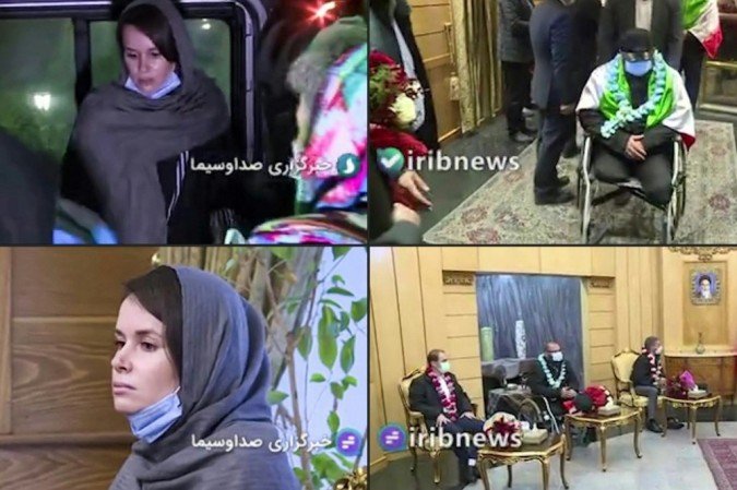 Esta combinação de imagens capturadas de imagens obtidas da TV estatal iraniana IRIB em 25 de novembro de 2020, mostra (E) a acadêmica australiana-britânica Kylie Moore-Gilbert ; e (D) três homens não identificados - um deles em uma cadeira de rodas - enrolados em bandeiras iranianas. - (crédito: IRIB NEWS AGENCY / AFP) Esta combinação de imagens capturadas de imagens obtidas da TV estatal iraniana IRIB em 25 de novembro de 2020, mostra (E) a acadêmica australiana-britânica Kylie Moore-Gilbert ; e (D) três homens não identificados - um deles em uma cadeira de rodas - enrolados em bandeiras iranianas. - (crédito: IRIB NEWS AGENCY / AFP)