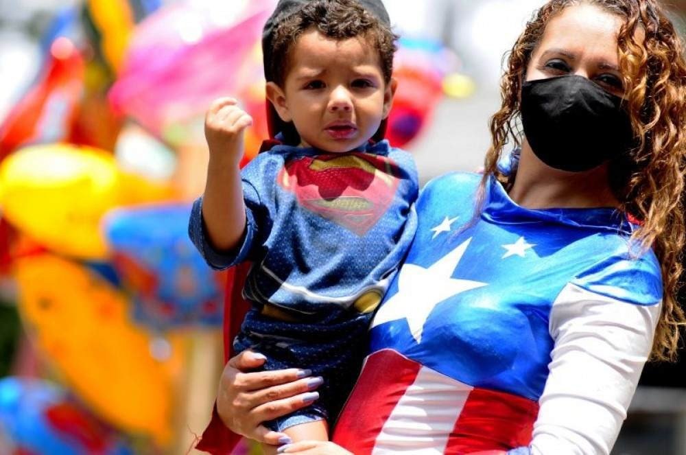 Movimentação do feriado no parque da cidade na terça feira de carnaval de 2021.-mãe fantasiada é Marli Alves dos Santos