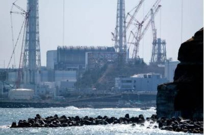 The Tokyo Electric Power Company Holdings (TEPCO) Fukushima Daiichi nuclear power plant is seen from the coast of Futaba town in Fukushima prefecture on March 10, 2021, on the eve of the 10th anniversary of the 9.0-magnitude earthquake which triggered a tsunami and nuclear disaster which killed over 18,000 people.  / AFP / Kazuhiro NOGI