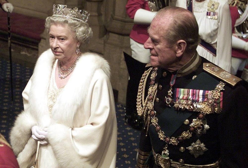 Britain's Queen Elizabeth II enters Parliament with her husband Prince Philip before delivering the annual Queen's Speech at the opening of Parliament in London Wednesday, Nov. 13, 2002. (AP Photo/Alastair Grant, Pool)