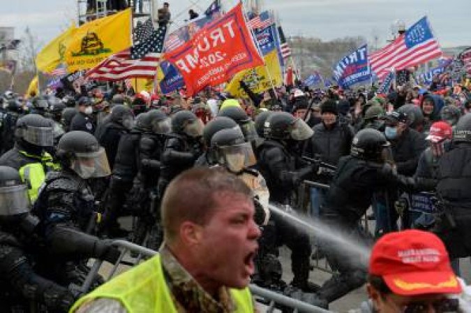 (FILES) In this file photo taken on January 6, 2021 Trump supporters clash with police and security forces as people try to storm the US Capitol in Washington DC.   The US government on June 15, 2021 unveiled its 