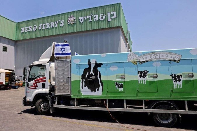 An Israeli flag is set atop a delivery truck outside US ice-cream maker Ben & Jerry's factory in Be'er Tuvia, on July 21, 2021. Ben & Jerry's announced that it will stop selling ice cream in the Israel-occupied Palestinian territories since it was 