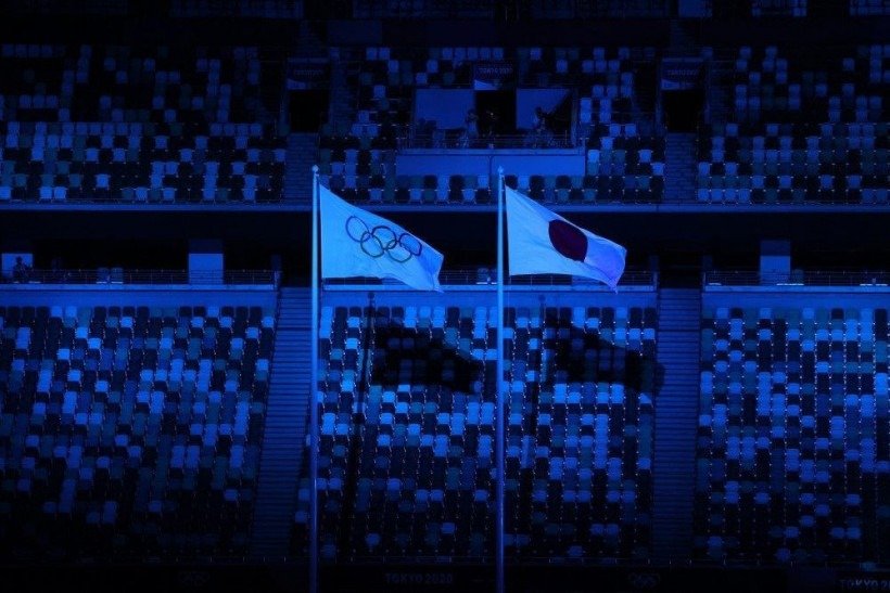 The Olympic and Japanese flags sway in the wind during the opening ceremony of the Tokyo 2020 Olympic Games, at the Olympic Stadium in Tokyo, on July 23, 2021.
LEON NEAL / POOL / AFP