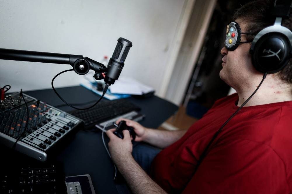 Blind streamer and Street Fighter V champion Sven van de Wege hosts a live on his Twitch channel 'BlindWarriorSven' in his apartment in The Hague on August 24, 2021.