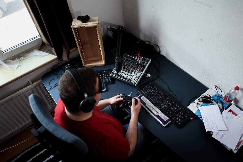 Blind streamer and Street Fighter V champion Sven van de Wege hosts a live on his Twitch channel 'BlindWarriorSven' in his apartment in The Hague on August 24, 2021.