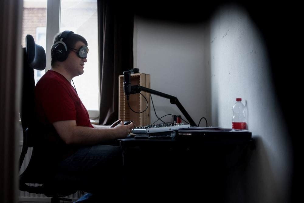 Blind streamer and Street Fighter V champion Sven van de Wege hosts a live on his Twitch channel 'BlindWarriorSven' in his apartment in The Hague on August 24, 2021.