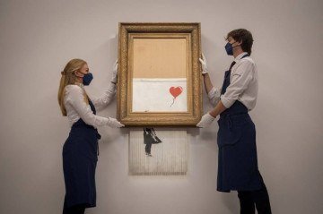 O Amor é a Lixeira, de Banksy: identidade do artista urbano britânico foi revelada  -  (crédito: Tolga Akmen / AFP)