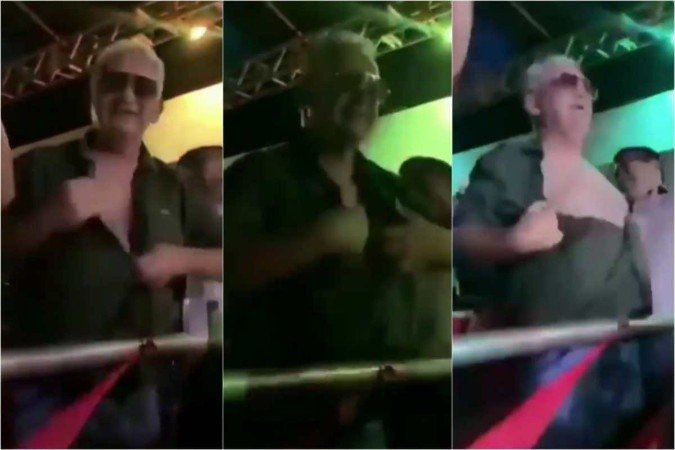 Após tirar a camisa e fazer comentários machistas, o prefeito Valmir Climaco (MDB) teve que deixar o local carregado pelos amigos -  (crédito: Twitter/Reprodução)