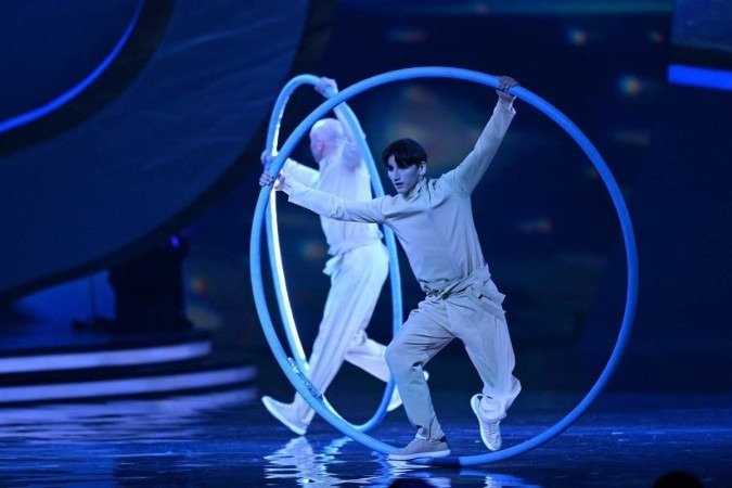  Os dançarinos se apresentam durante o sorteio da Copa do Mundo de 2022 no Qatar, no Centro de Exposições e Convenções de Doha, em 1º de abril de 2022. (Foto de François-Xavier MARIT / AFP)