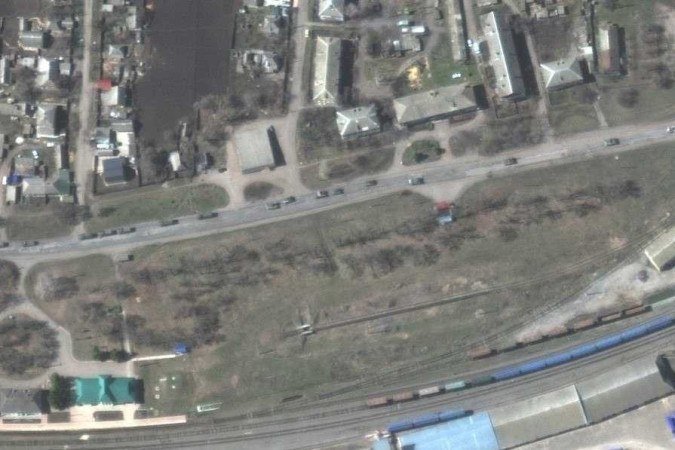  This handout satellite image released by Maxar Technologies shows a large military convoy consisting of hundreds of vehicles (including armored vehicles, trucks with towed artillery and support equipment) moving south through the Ukrainian town of Velykyi Burluk, Ukraine, April 8, 2022. - Recent Maxar satellite imagery collected on April 8, 2022 identified a large military convoy consisting of hundreds of vehicles (including armored vehicles, trucks with towed artillery and support equipment) that extends for at least eight miles moving south through the Ukrainian town of Velykyi Burluk (location: 50.060, 37.384). (Photo by Satellite image ©2022 Maxar Technologies / AFP) / RESTRICTED TO EDITORIAL USE - MANDATORY CREDIT 
