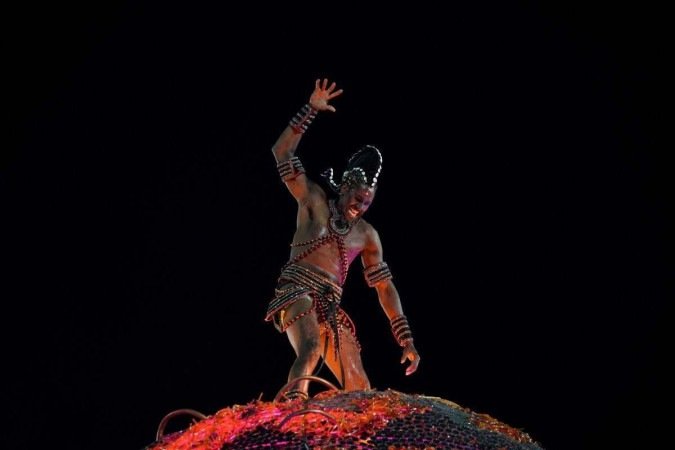  Members of Grande Rio samba school perform during the second night of Rio's Carnival parade at the Sambadrome Marques de Sapucai in Rio de Janeiro on April 24, 2022. (Photo by Mauro Pimentel / AFP)
      Caption 