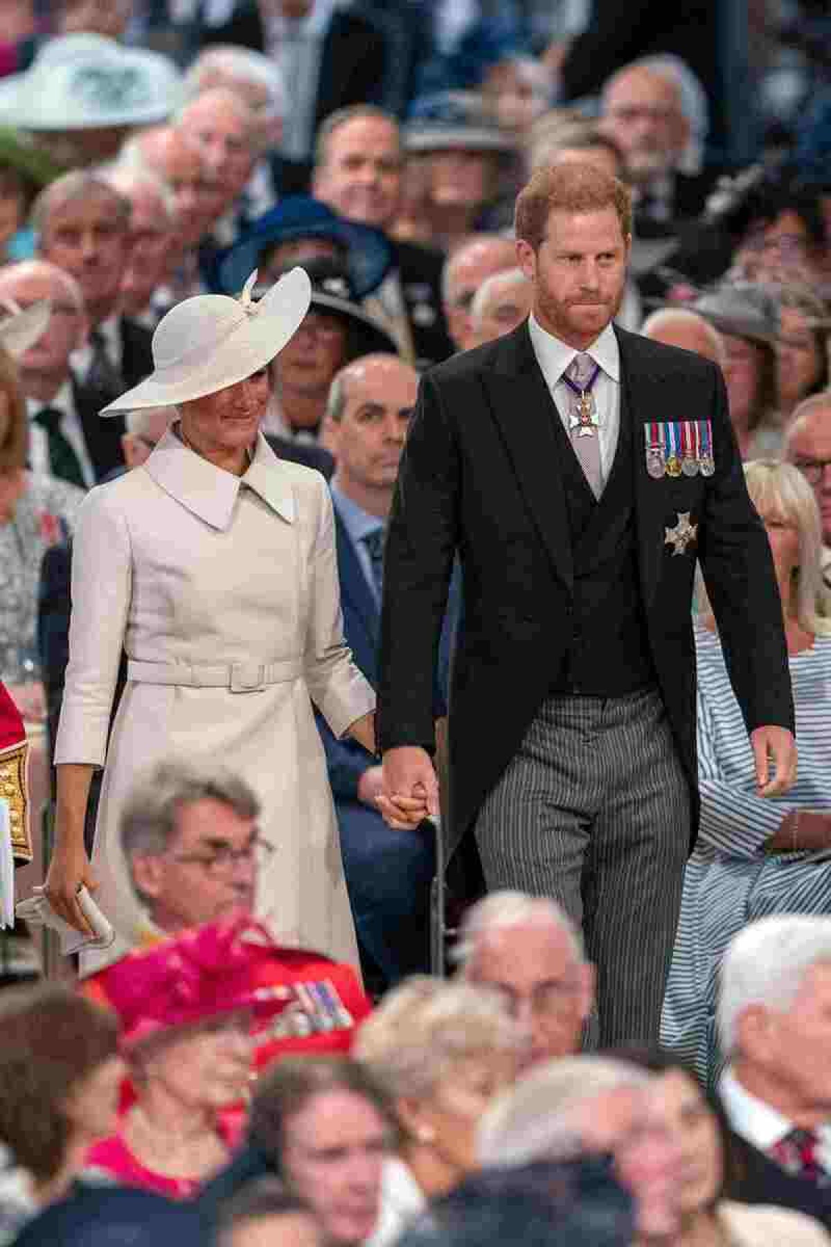  Britain's Prince Harry, Duke of Sussex (R) and Britain's Meghan, Duchess of Sussex (L) attend the National Service of Thanksgiving for The Queen's reign at Saint Paul's Cathedral in London on June 3, 2022 as part of Queen Elizabeth II's platinum jubilee celebrations. Queen Elizabeth II kicked off the first of four days of celebrations marking her record-breaking 70 years on the throne, to cheering crowds of tens of thousands of people. But the 96-year-old sovereign's appearance at the Platinum Jubilee -- a milestone never previously reached by a British monarch -- took its toll, forcing her to pull out of a planned church service. (Photo by ARTHUR EDWARDS / POOL / AFP)        