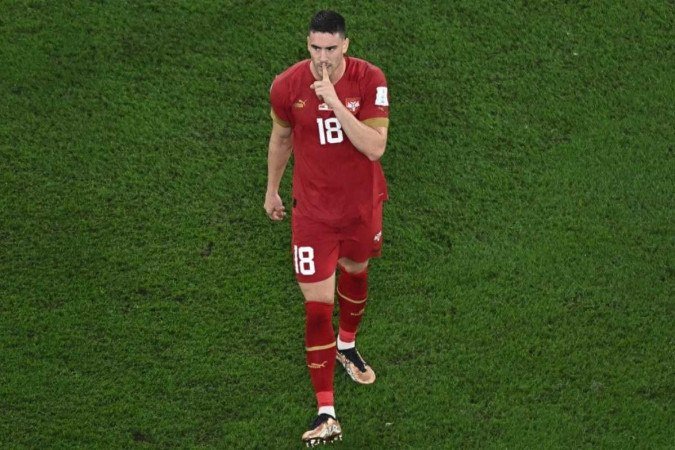  Serbia's forward #18 Dusan Vlahovic celebrates after scoring his team's second goal during the Qatar 2022 World Cup Group G football match between Serbia and Switzerland at Stadium 974 in Doha on December 2, 2022. (Photo by MANAN VATSYAYANA / AFP)
      