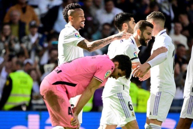  Real Madrid's Spanish midfielder Marco Asensio (C,R) celebrates with Real Madrid's Brazilian defender Eder Militao (L) scoring his team's third goal during the Spanish league football match between Real Madrid CF and RCD Espanyol at the Santiago Bernabeu stadium in Madrid on March 11, 2023. (Photo by JAVIER SORIANO / AFP)
      