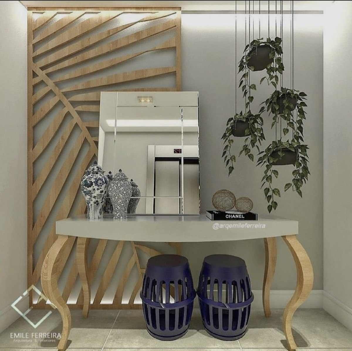 Hall de entrada com aparador, espelho e plantas, da arquiteta Emile Ferreira. O projeto mostra que uma simples entrada pode se transformar em um ponto de atenção na casa