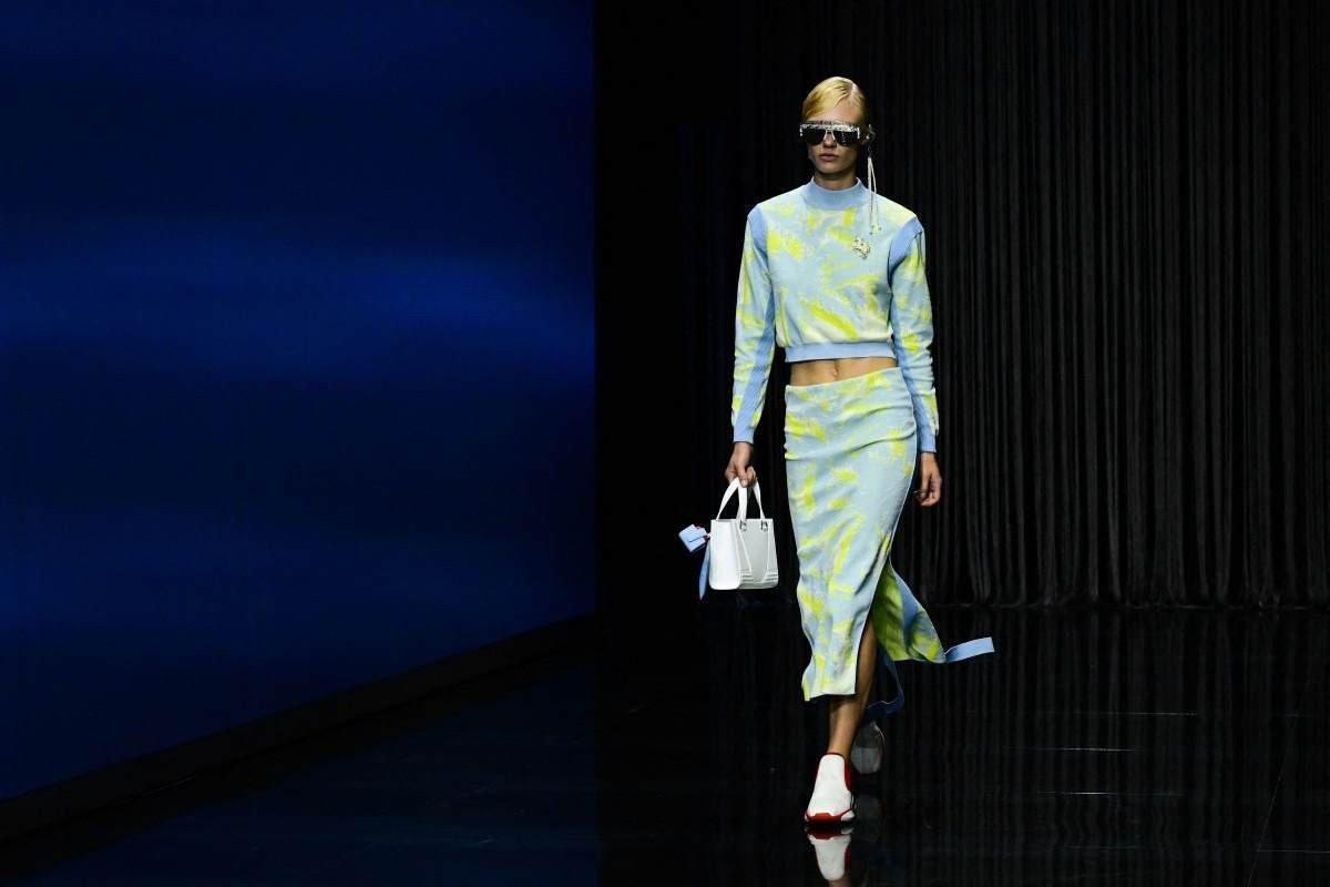 A model presents a creation for Ferrari's Women's and Men's Spring Summer 2023 fashion collection on September 25, 2022 as part of the Fashion Week in Milan. (Photo by Miguel MEDINA / AFP) A model presents a creation for Ferrari's Women's and Men's Spring Summer 2023 fashion collection on September 25, 2022 as part of the Fashion Week in Milan. (Photo by Miguel MEDINA / AFP)