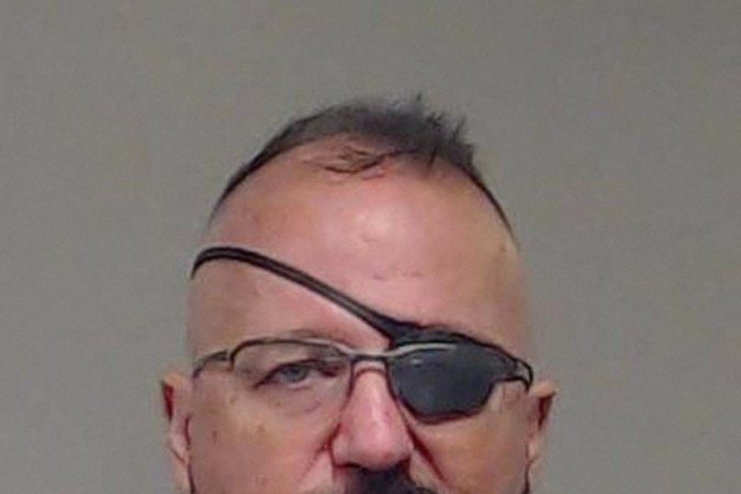  (FILES) This booking photo released by Collin County Sheriff's Office in Texas on January 13, 2022 shows Elmer Stewart Rhodes, III. Rhodes, founder of the far-right Oath Keepers militia, was dealt an 18 year prison sentence on May 25, 2023, for seditious conspiracy in the 2021 attack on the US Capitol, the toughest penalty given yet over the January 6 assault. 