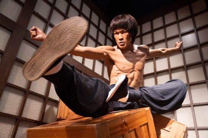 In this photo taken on July 18, 2023 a wax figure of Bruce Lee is pictured at the Madame Tussauds wax museum in Hong Kong, ahead of the 50th anniversary of the martial arts star's death on July 20. The martial arts legend Bruce Lee, whose films spawned a kung fu craze around the world, was one of the first Asian men to achieve Hollywood superstardom, and his influence can still be felt in Hong Kong as fans held exhibitions and martial arts workshops this week to mark the 50th anniversary of his death.