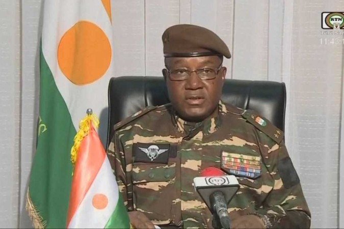  This video frame grab image obtained by AFP from ORTN - Télé Sahel on July 28, 2023 shows General Abdourahamane Tchiani, Niger?s new strongman, speaking on national television and reads a statement as 