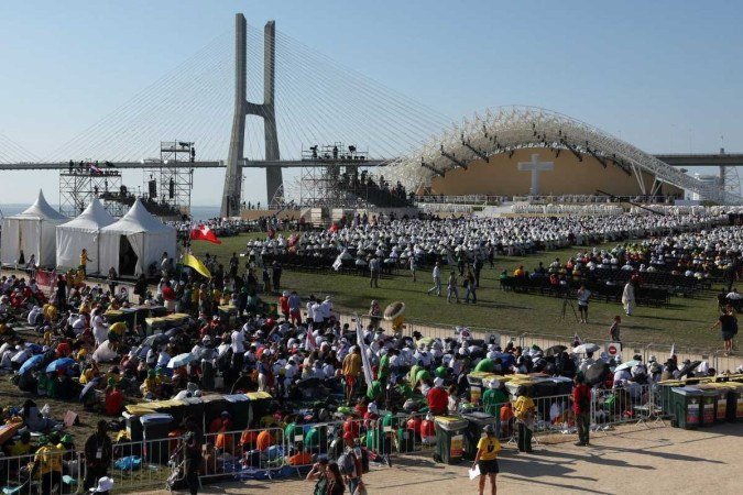 Vista geral do Parque do Tejo durante a missa de encerramento da Jornada Mundial da Juventude (JMJ), oficiada pelo Papa, em Lisboa no dia 6 de agosto de 2023. - (crédito: Pierre-Philippe MARCOU / AFP) Vista geral do Parque do Tejo durante a missa de encerramento da Jornada Mundial da Juventude (JMJ), oficiada pelo Papa, em Lisboa no dia 6 de agosto de 2023. - (crédito: Pierre-Philippe MARCOU / AFP)