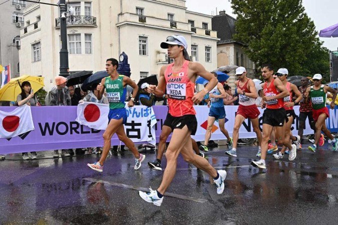 Brazil's Caio Bonfim (L) and Japan's Koki Ikeda (C) compete in the men's 20km race walk final during the World Athletics Championships in Budapest on August 19, 2023.