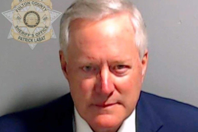  ATLANTA, GEORGIA - AUGUST 24: In this handout provided by the Fulton County Sheriff's Office, former White House Chief of Staff Mark Meadows poses for his booking photo on August 24, 2023 in Atlanta, Georgia. Former President Donald Trump and 18 others facing felony charges in the indictment related to tampering with the 2020 election in Georgia have been ordered to turn themselves in by August 25.   Fulton County Sheriff's Office via Getty Images/AFP (Photo by Handout / GETTY IMAGES NORTH AMERICA / Getty Images via AFP)
      