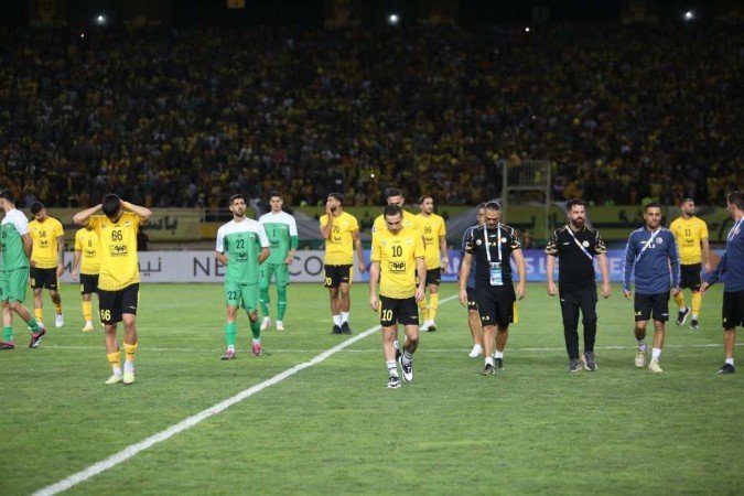 A Fifa proíbe qualquer tipo de manifestação política por parte dos clubes
- (crédito: MORTEZA SALEHI / TASNIM NEWS / AFP) A Fifa proíbe qualquer tipo de manifestação política por parte dos clubes
- (crédito: MORTEZA SALEHI / TASNIM NEWS / AFP)