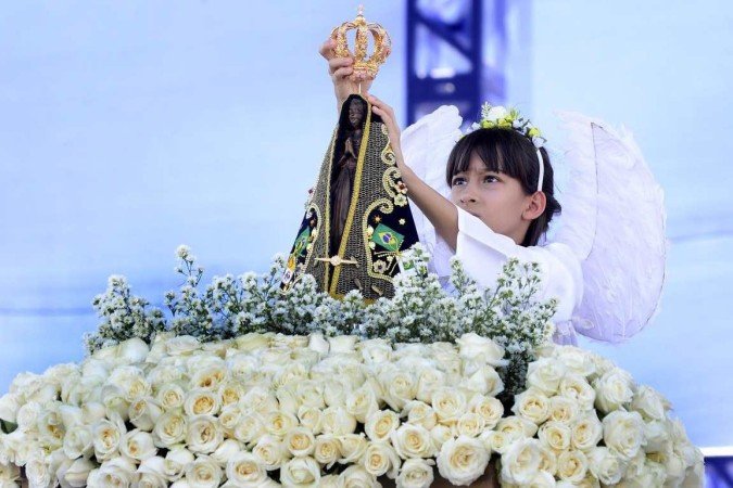 O servidor federal José Leitão, 47, levou os filhos à festa da padroeira