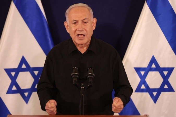 Israeli Prime Minister Benjamin Netanyahu speaks during a press conference in the Kirya military base in Tel Aviv on October 28, 2023 amid ongoing battles between Israel and the Palestinian group Hamas. Netanyahu said on October 28 that fighting inside the Gaza Strip would be Israeli Prime Minister Benjamin Netanyahu speaks during a press conference in the Kirya military base in Tel Aviv on October 28, 2023 amid ongoing battles between Israel and the Palestinian group Hamas. Netanyahu said on October 28 that fighting inside the Gaza Strip would be