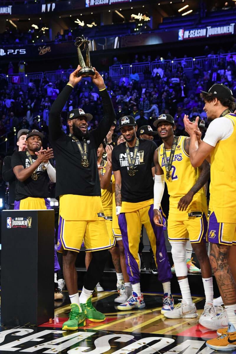LeBron James #23 of the Los Angeles Lakers receives the In-Season Tournament MVP Trophy after winning the In-Season Tournament Championship game against the Indiana Pacers on December 9, 2023 at T-Mobile Arena in Las Vegas, Nevada.