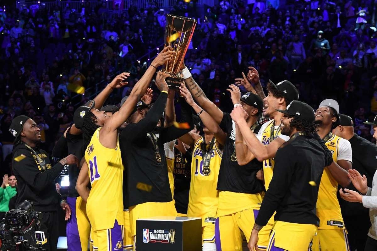 The Los Angeles Lakers celebrate with the NBA Cup after winning the In-Season Tournament Championship game against the Indiana Pacers on December 9, 2023 at T-Mobile Arena in Las Vegas, Nevada.