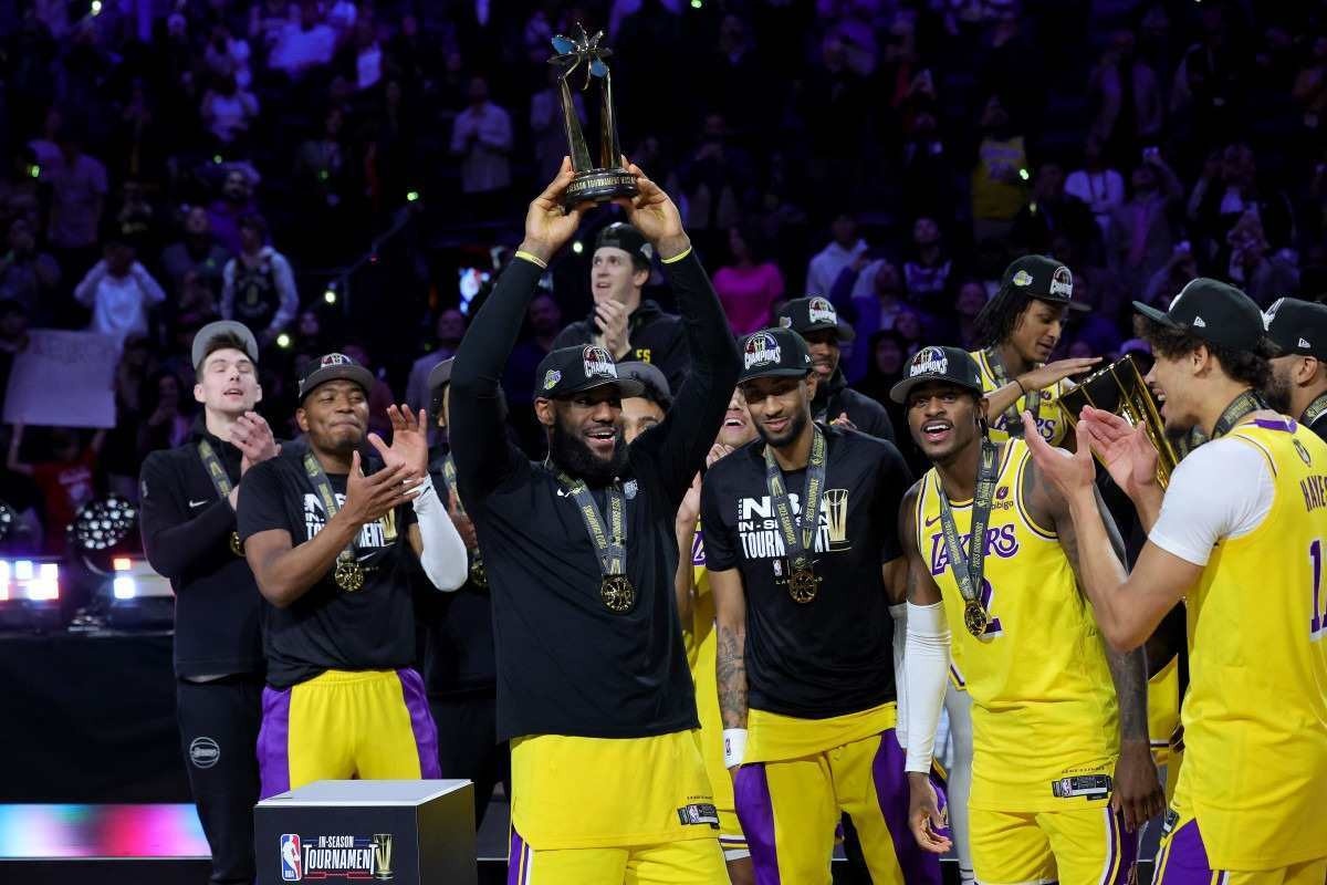 LeBron James #23 of the Los Angeles Lakers hoists the MVP trophy after winning the championship game of the inaugural NBA In-Season Tournament at T-Mobile Arena on December 09, 2023 in Las Vegas, Nevada.       