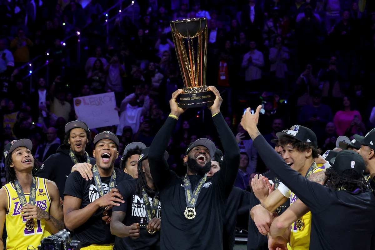 LeBron James #23 of the Los Angeles Lakers hoists the trophy with his teammates after winning the championship game of the inaugural NBA In-Season Tournament at T-Mobile Arena on December 09, 2023 in Las Vegas, Nevada.