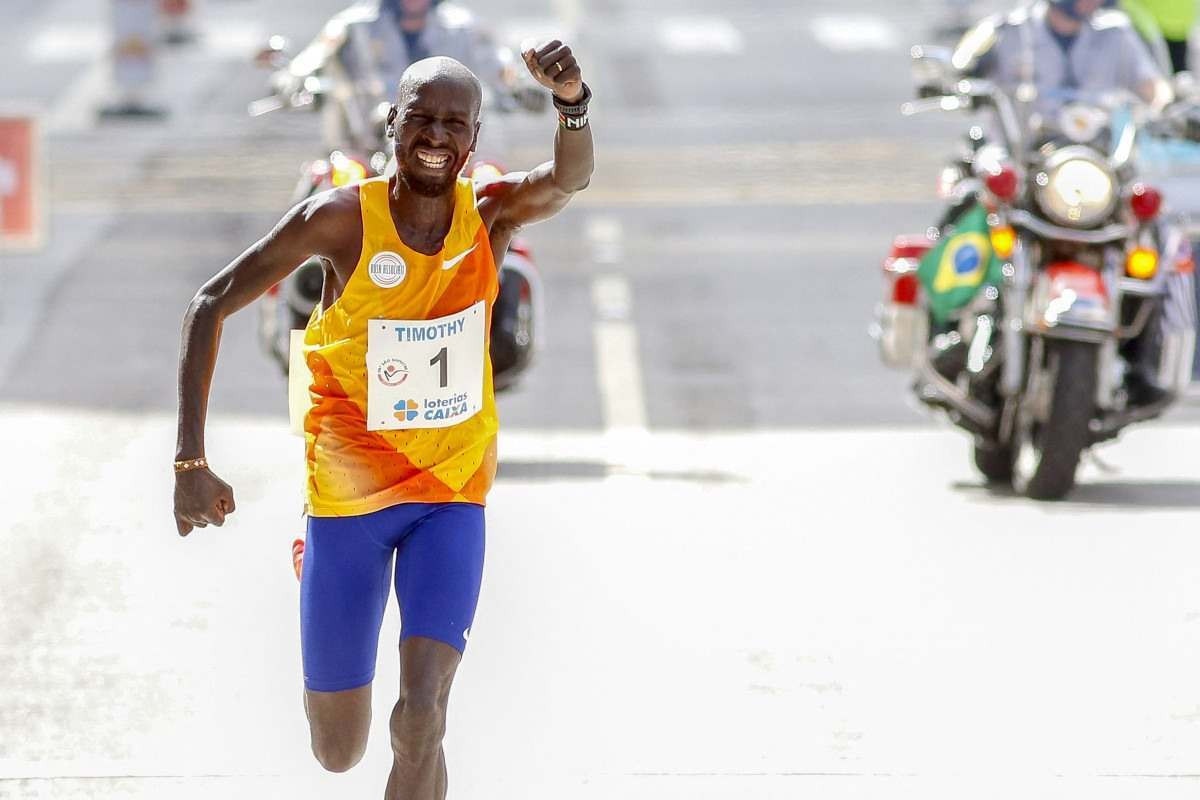 Kenyan runner Timothy Kiplagat crosses the finish line to win the 98th 15-km Sao Silvestre international race in Sao Paulo, Brazil, on December 31, 2023.