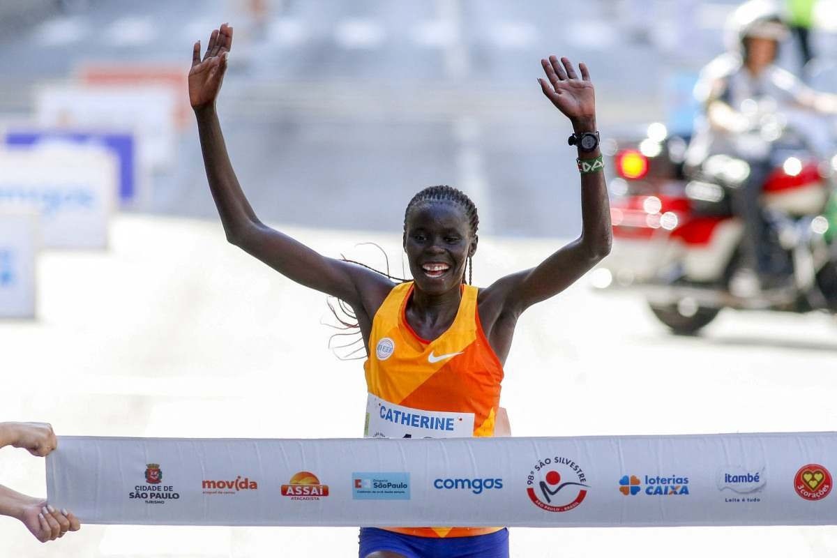 Kenyan runner Catherine Reline crosses the finish line to win the 98th 15-km Sao Silvestre international race in Sao Paulo, Brazil, on December 31, 2023.