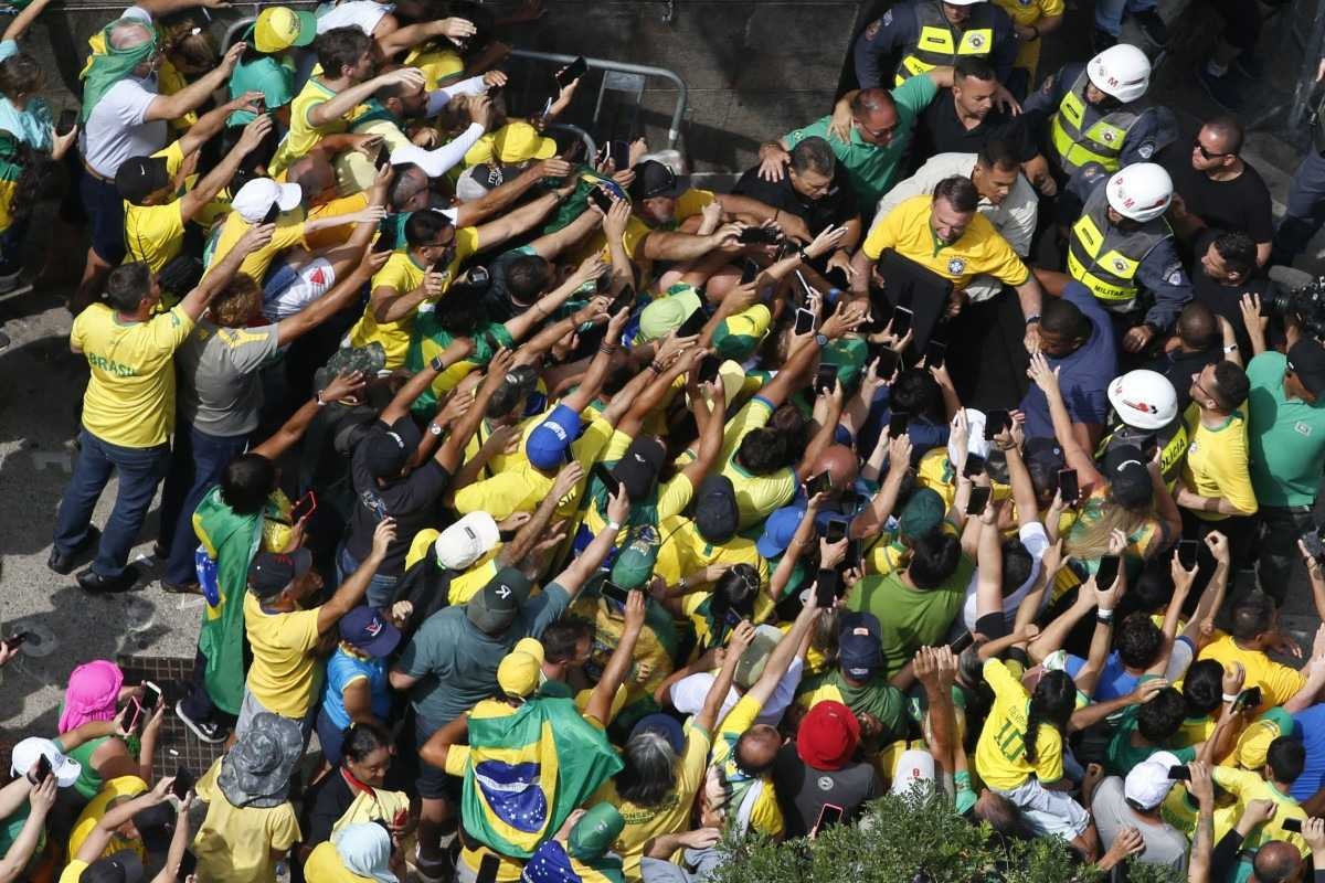  Aerial view showing former Brazilian President Jair Bolsonaro (2019-2022) arriving at a rally in Sao Paulo, Brazil, on February 25, 2024, to reject claims he plotted a coup with allies to remain in power after his failed 2022 reelection bid. Investigators say the far-right ex-army captain led a plot to falsely discredit the Brazilian election system and prevent the winner of the vote, leftist President Luiz Inacio Lula da Silva, from taking power. A week after Lula took office on January 1, 2023, thousands of Bolsonaro supporters stormed the presidential palace, Congress and Supreme Court, urging the military to intervene to overturn what they called a stolen election. (Photo by Miguel SCHINCARIOL / AFP)       