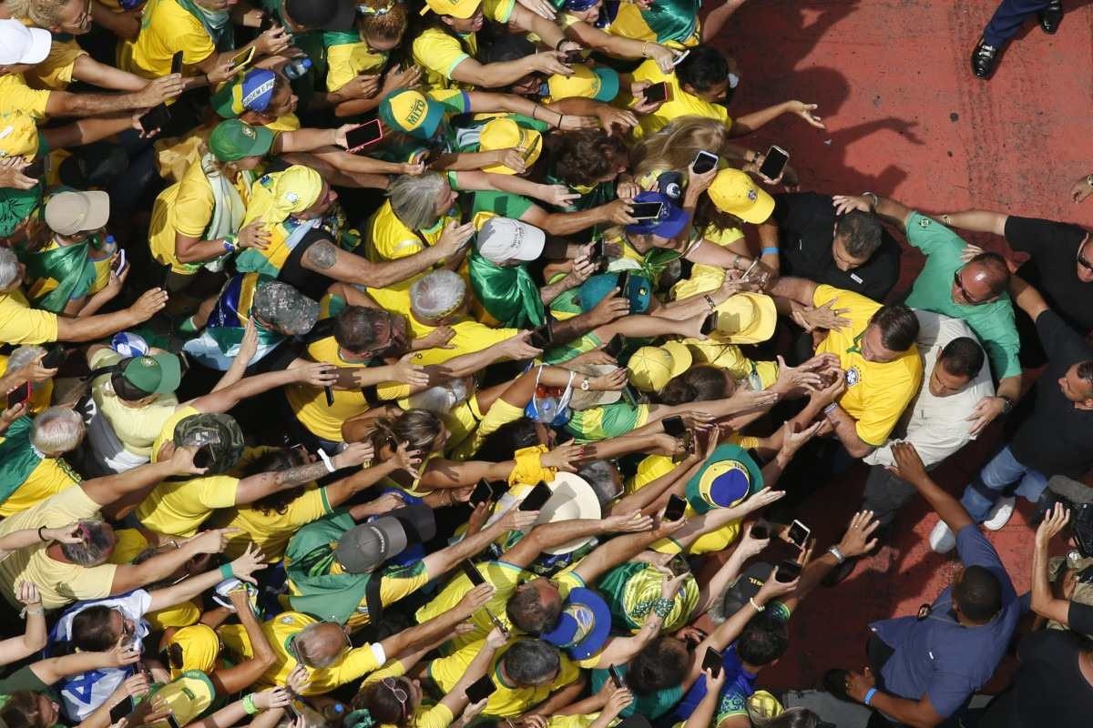  Aerial view showing former Brazilian President Jair Bolsonaro (2019-2022) arriving at a rally in Sao Paulo, Brazil, on February 25, 2024, to reject claims he plotted a coup with allies to remain in power after his failed 2022 reelection bid. Investigators say the far-right ex-army captain led a plot to falsely discredit the Brazilian election system and prevent the winner of the vote, leftist President Luiz Inacio Lula da Silva, from taking power. A week after Lula took office on January 1, 2023, thousands of Bolsonaro supporters stormed the presidential palace, Congress and Supreme Court, urging the military to intervene to overturn what they called a stolen election. (Photo by Miguel SCHINCARIOL / AFP)       