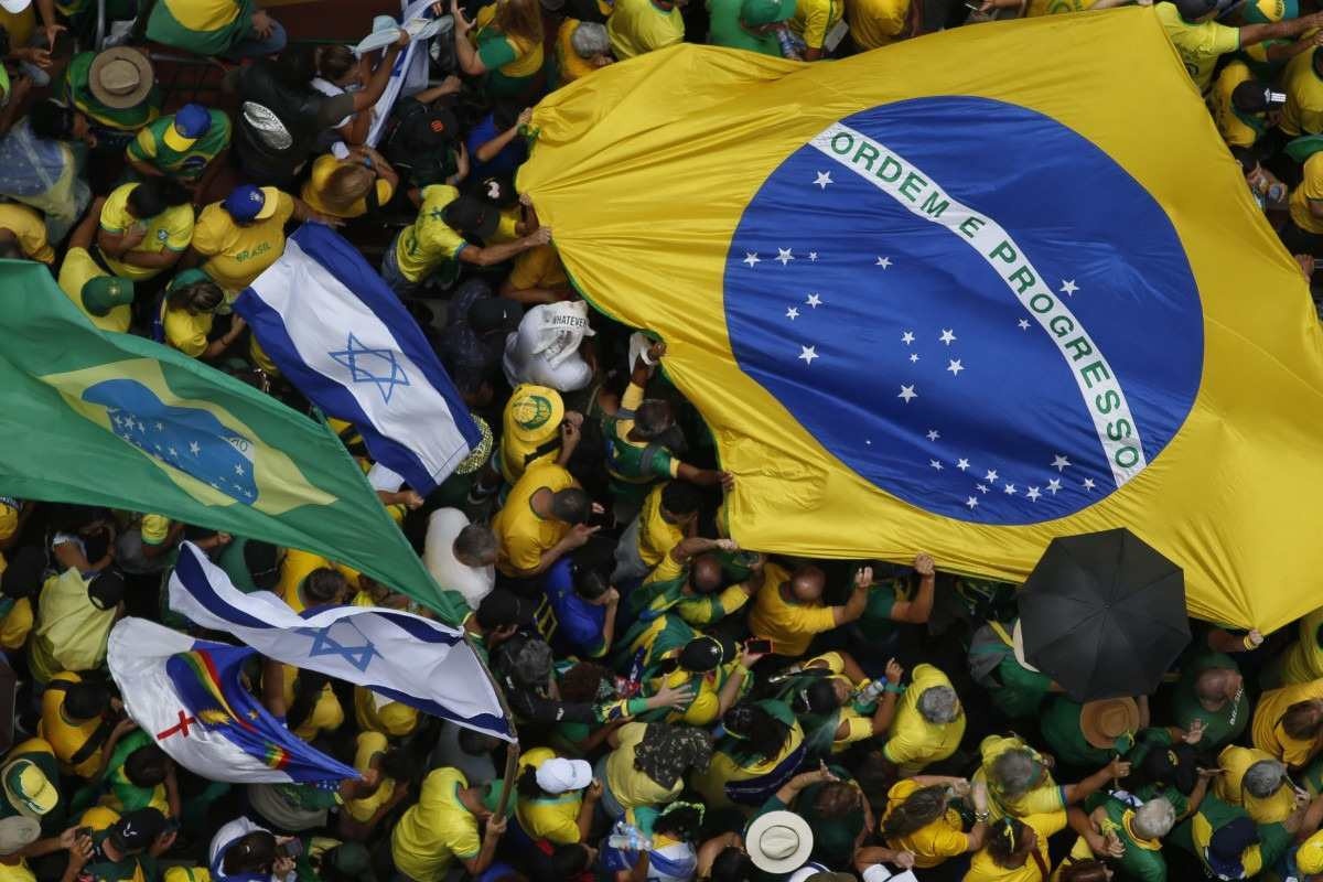  Aerial view showing supporters of former Brazilian President Jair Bolsonaro (2019-2022) attending a rally in Sao Paulo, Brazil, on February 25, 2024, to reject claims he plotted a coup with allies to remain in power after his failed 2022 reelection bid. Investigators say the far-right ex-army captain led a plot to falsely discredit the Brazilian election system and prevent the winner of the vote, leftist President Luiz Inacio Lula da Silva, from taking power. A week after Lula took office on January 1, 2023, thousands of Bolsonaro supporters stormed the presidential palace, Congress and Supreme Court, urging the military to intervene to overturn what they called a stolen election. (Photo by Miguel SCHINCARIOL / AFP)       