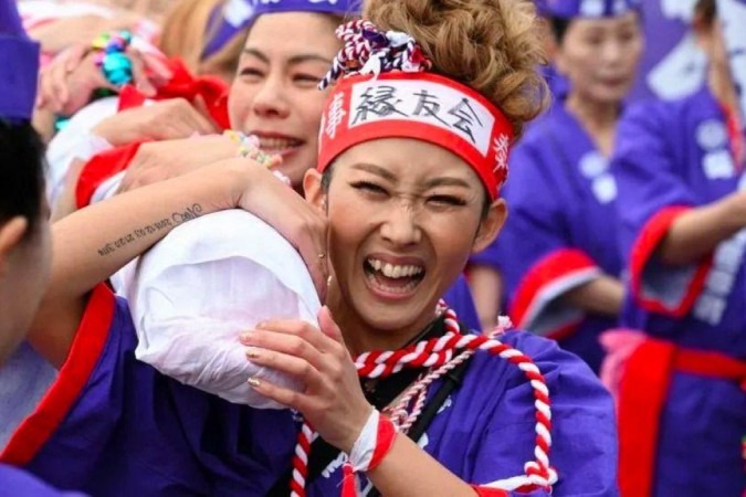 As mulheres participaram do festival pela primeira vez em seus 1.250 anos de história -  (crédito: Reuters)