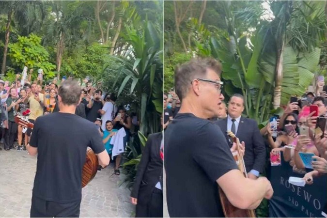 vocalista do Blink-182 toca violão para fãs em frente a hotel -  (crédito: Reprodução redes sociais)