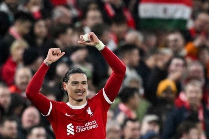 Jogadores de Liverpool e Sheffield em disputa de bola na Premier League - Foto: Paul Ellis/AFP via Getty Images - (crédito: Foto: Paul Ellis/AFP via Getty Images) Jogadores de Liverpool e Sheffield em disputa de bola na Premier League - Foto: Paul Ellis/AFP via Getty Images - (crédito: Foto: Paul Ellis/AFP via Getty Images)