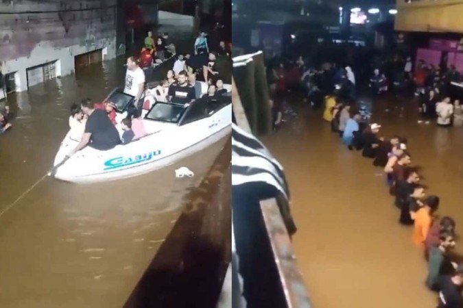 Um vídeo que circula nas redes sociais mostra o momento em que voluntários fazem cordão humano e puxam os barcos com os resgatados - (crédito: Reprodução / Redes Sociais) Um vídeo que circula nas redes sociais mostra o momento em que voluntários fazem cordão humano e puxam os barcos com os resgatados - (crédito: Reprodução / Redes Sociais)